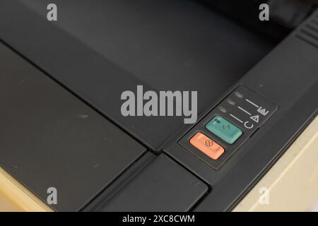 Closeup of Printer Operation Panel with Blue and Red Buttons Stock Photo