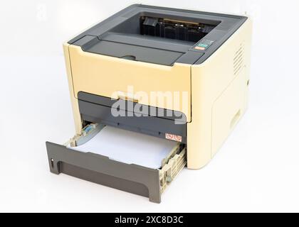 Laser printer paper with open empty paper tray isolated on a white background Stock Photo