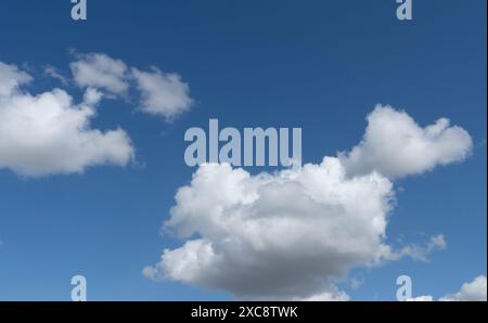 Cumulus clouds in blue sky Stock Photo