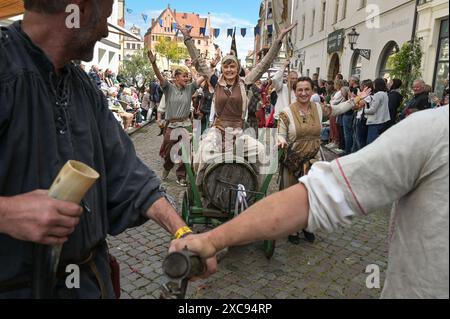 Lutherstadt Wittenberg, Germany. 15th June, 2024. The procession for Luther's wedding marches through the city center. The Wittenberg festival 'Luther's Wedding' takes place this weekend. On June 13, 1525, the former monk Martin Luther and the escaped nun Katharina von Bora married in Wittenberg. Credit: Heiko Rebsch/dpa/Alamy Live News Stock Photo