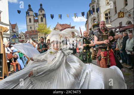 Lutherstadt Wittenberg, Germany. 15th June, 2024. A dancer in the procession for Luther's wedding. The Wittenberg festival 'Luther's Wedding' takes place this weekend. On June 13, 1525, the former monk Martin Luther and the escaped nun Katharina von Bora married in Wittenberg. Credit: Heiko Rebsch/dpa/Alamy Live News Stock Photo