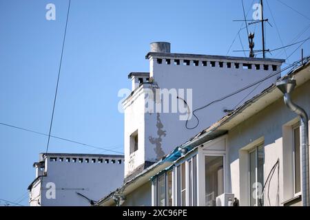 2 chimney pots on a roof with TV aerial, horizontal Stock Photo