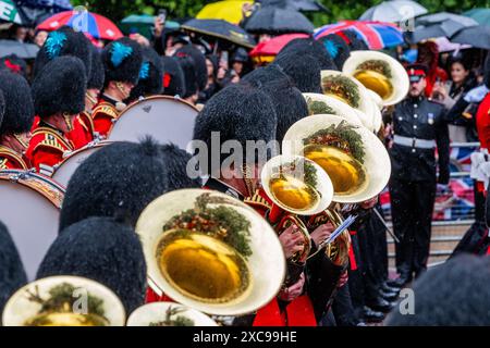 London, UK. 15th June, 2024. Heavy rain falls and the umbrellas are out - Trooping the Colour to Celebrate the Official Birthday of King Charles III. Number 9 Company, Irish Guards. Credit: Guy Bell/Alamy Live News Stock Photo