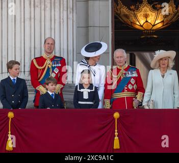 London, UK. 15th June, 2024. In a mix of torrential rain, thunder & lightning, and finally sunshine Trooping the Colour for the King’s Official Birthday Parade takes place. in Horse Guards Parade ground with King Charles III taking the salute and No 9 Company Irish Guards trooping the Colour. After the Parade the Royal Family, including Catherine, Princess of Wales, appear on the balcony of Buckingham Palace to wave to the large crowd of wellwishers and spectators who gather outside the Palace spilling onto The Mall. Credit: Malcolm Park/Alamy Live News Stock Photo