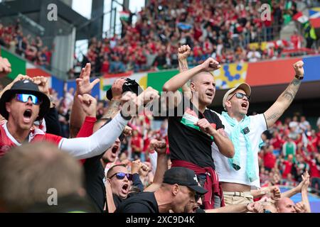 Cologne, Germany. 15th June, 2024. Fans cheer during the UEFA Euro 2024 Group A match between Hungary and Switzerland in Cologne, Germany, June 15, 2024. Credit: Meng Dingbo/Xinhua/Alamy Live News Stock Photo