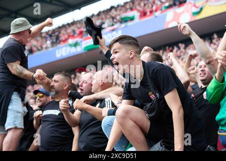 Cologne, Germany. 15th June, 2024. Fans cheer during the UEFA Euro 2024 Group A match between Hungary and Switzerland in Cologne, Germany, June 15, 2024. Credit: Meng Dingbo/Xinhua/Alamy Live News Stock Photo