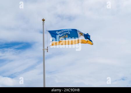 Mundesley, North Norfolk, UK - June 15th 2024: Seaside of the year award 2024 flag flying in Mundesley North Norfolk, UK, on a windy day Stock Photo