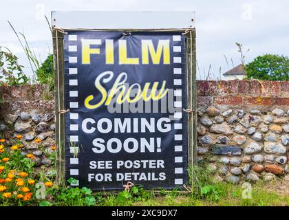Film Show Coming Soon Poster next to a wall in landscape orientation Stock Photo