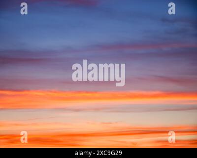 A picturesque view of the evening sky’s vibrant yet calming colors; perfect for desktop wallpapers or screensavers. Stock Photo