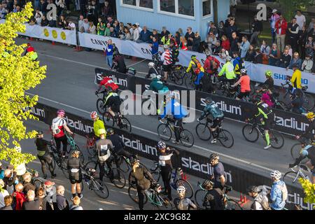 Cyclists in Motala, Sweden, during one of the world's largest recreational bicycle race, Vätternrundan, on Friday. Stock Photo