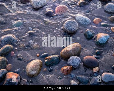 WA25340-00...WASHINGTON - Colorful beach rocks at West Point on Rosario Strait in Deception Pass State Park. Stock Photo