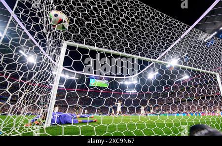 Emre Can, DFB 25 scores, shoots goal, Tor, Treffer, Torschuss, 5-1 against Angus Gunn, SCO 1 in the group stage match GERMANY - SCOTLAND 5-1 of the UEFA European Championships 2024 on Jun 14, 2024 in Munich, Germany. Photographer: ddp images/star-images Credit: ddp media GmbH/Alamy Live News Stock Photo