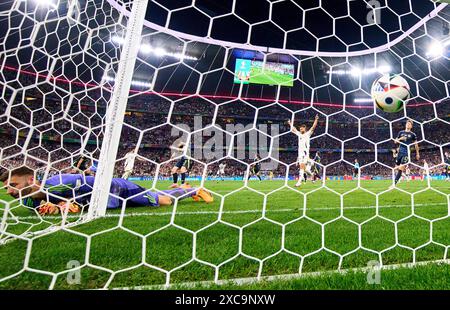 Emre Can, DFB 25 scores, shoots goal, Tor, Treffer, Torschuss, 5-1 against Angus Gunn, SCO 1 in the group stage match GERMANY - SCOTLAND 5-1 of the UEFA European Championships 2024 on Jun 14, 2024 in Munich, Germany. Photographer: ddp images/star-images Credit: ddp media GmbH/Alamy Live News Stock Photo