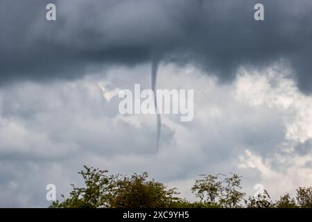 Beverley, East Yorkshire. 15th June 2024. UK weather - 15 June 2024  Waterspout forms in the skies above the reservoir at Tophill Low Nature Reserve and retreats before touching down. East Yorkshire, England, UK. Credit: Rebecca Cole/Alamy Live News Stock Photo