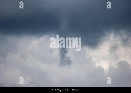 Beverley, East Yorkshire. 15th June 2024. UK weather - 15 June 2024  Waterspout forms in the skies above the reservoir at Tophill Low Nature Reserve and retreats before touching down. East Yorkshire, England, UK. Credit: Rebecca Cole/Alamy Live News Stock Photo