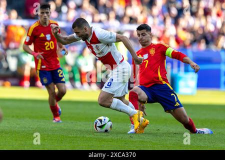 Berlin, Germany. 15th June, 2024. Mateo Kovacic and Alvaro Morata are playing during the UEFA Euro 2024 Group B match between Spain and Croatia at the Olympiastadion Berlin in Berlin, Germany, on June 15, 2024. (Photo by Andrzej Iwanczuk/NurPhoto) Credit: NurPhoto SRL/Alamy Live News Stock Photo