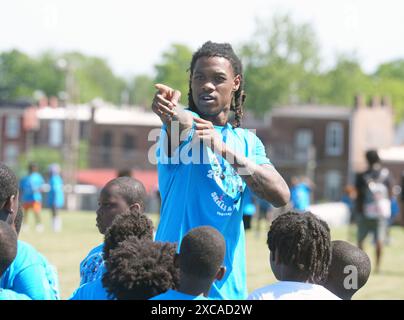 St. Louis, United States. 15th June, 2024. Detroit Lions wide receiver Jameson Williams, gives participants direction during the Jameson Williams 'Skills and Drills Football Camp,' at the Herbert Hoover Boys and Girls Club in St. Louis on Saturday, June 15, 2024. Photo by Bill Greenblatt/UPI Credit: UPI/Alamy Live News Stock Photo