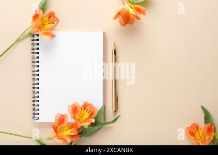 Guest list. Notebook, pen and beautiful flowers on beige background, flat lay. Space for text Stock Photo