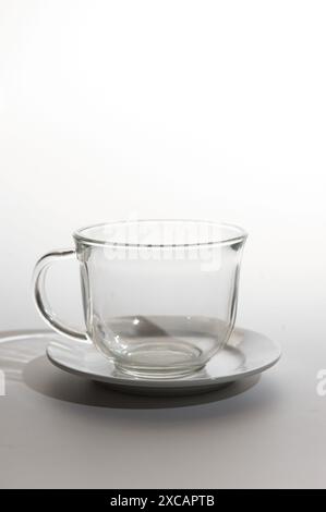 An empty, clear glass coffee cup isolated on a white background Stock Photo