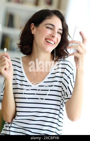 Woman listening music with smartphone Stock Photo