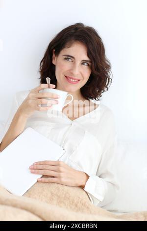 Portrait of Woman holding cup of coffee Stock Photo