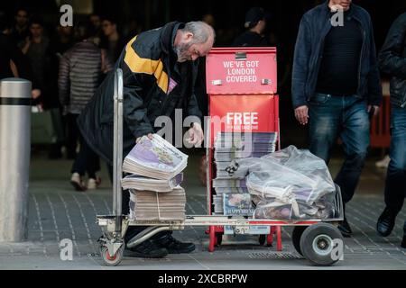 London Evening Standard newspaper distribution outside London bridge station. Stock Photo