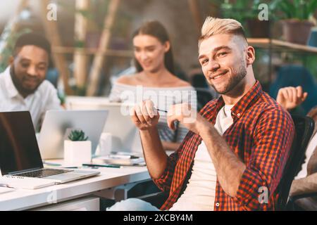 Diverse Team Collaborating in Modern Office During Daytime Stock Photo