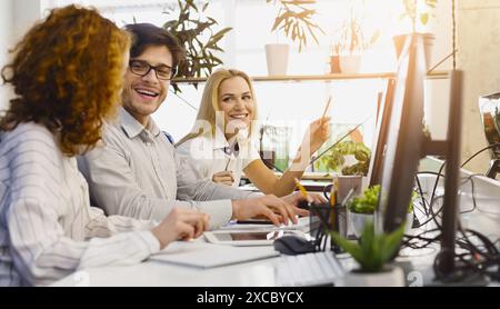 Diverse Professionals Working Together in Modern Office Stock Photo