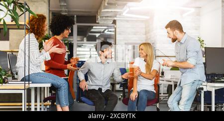 Creative Team Engaging in Brainstorming Session at a Modern Office Stock Photo