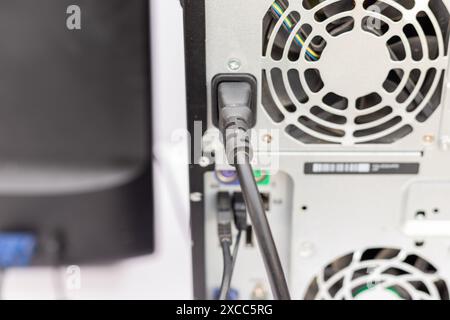 Power Cord Connected to a Computer Case Stock Photo