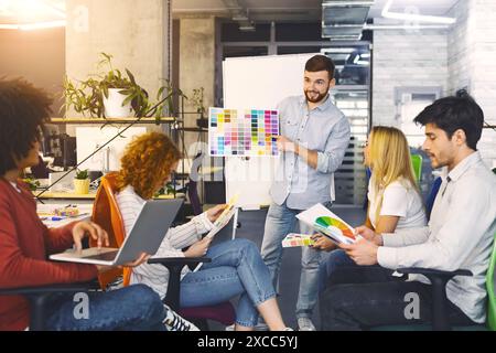 Collaborative Team Meeting in Office Space During Creative Brainstorming Session Stock Photo