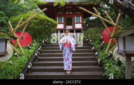 Girl in traditional Japanese clothing Yukata in a Tokyo park Stock Photo