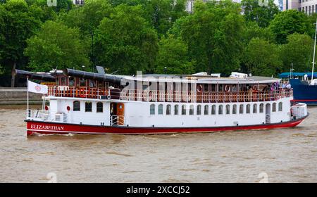 London, United Kingdom - July 2, 2010  :  Paddle steamer Elizabethan on River Thames. Restaurant ship based on replica of Mississippi River paddleship Stock Photo