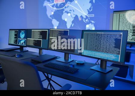 Cyber security command center with multiple monitors displaying data analysis and network information Stock Photo