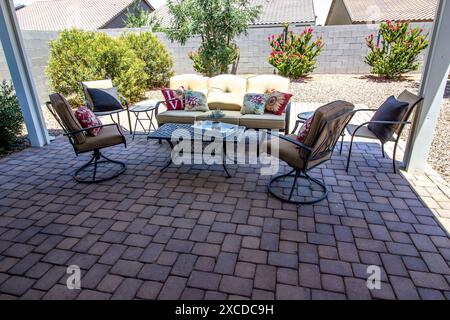 Wrought Iron Furniture Under Pergola On Pavers Patio Stock Photo