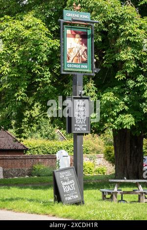 The George Inn at Babraham Green King pub sign and chalkboards South Cambridgeshire Stock Photo