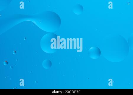 Abstract image with blue bubbles on a light blue gradient background Stock Photo
