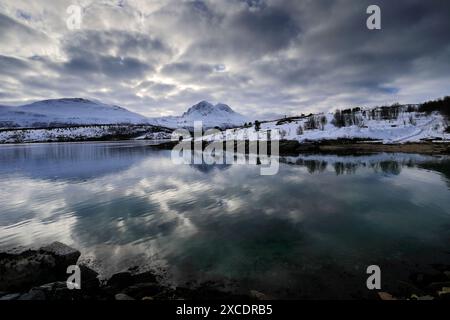Mountain reflections along Balsfjorden, a scenic Fjord south of Tromso city, Northern Norway Stock Photo