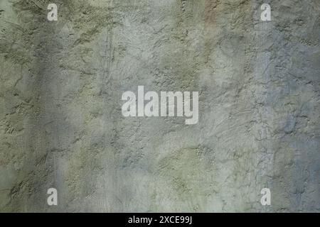 Rough texture: old plastered wall shimmering in various blue-grey-green shades, Germany Stock Photo