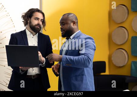 Team of corporation employees preparing their pitch for the shareholders meeting, working on ways to obtain more funds. Colleagues attend a conference to address financial status. Stock Photo