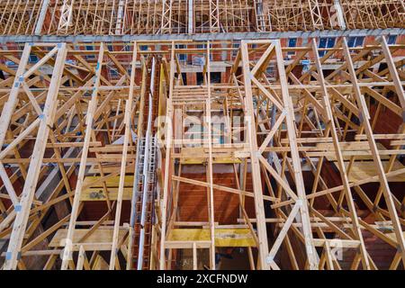 New house under construction, wooden truss system forming roof. Process of building project. Stock Photo