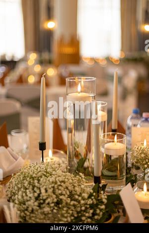 Elegant wedding reception table setting with candlelight Stock Photo