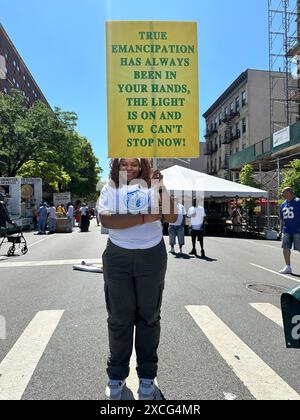 New York, N.Y. - June 15, 2024: Participant in the 31st annual Harlem Juneteenth Celebration Parade which is organized by Masjid Malcom Shabazz. Juneteenth is a federal holiday commemorating the end of slavery in the United States on June 19, 1865, when Major General Gordon Granger ordered the final enforcement of the Emancipation Proclamation in Texas at the end of the American Civil War. Stock Photo