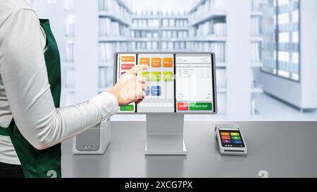 Touch screen point of sale system or cash register machine on desk with finger point Stock Photo