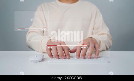 A man using mouse and keyboard for streaming online, watching video on internet, live concert, show or tutorial, live streaming video on internet, dig Stock Photo