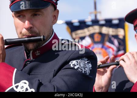 Members of Bangor Protestant Boys Flute band on return leg of annual Royal Landing parade in Carrickfergus, Northern Ireland. Saturday 8th June 2024. Stock Photo