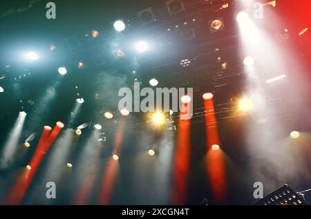 ceiling spotlights working during the show, musical concert light with spotlights and mist Stock Photo