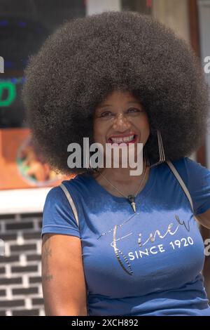 An attractive middle aged woman with a terrific Afro hairdo at the annual Juneteenth Parade in Peekskill,, New York. Stock Photo