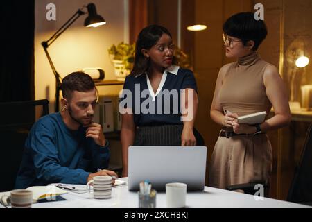 Group of business people working on pitch deck for new project Stock Photo