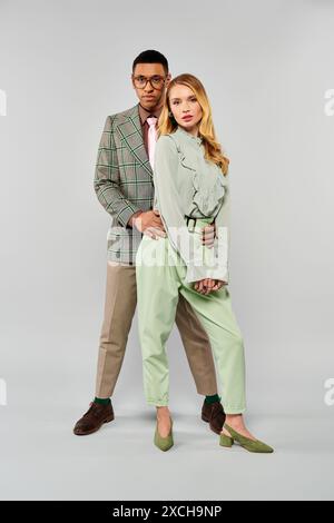 A man and a woman striking a pose together Stock Photo - Alamy